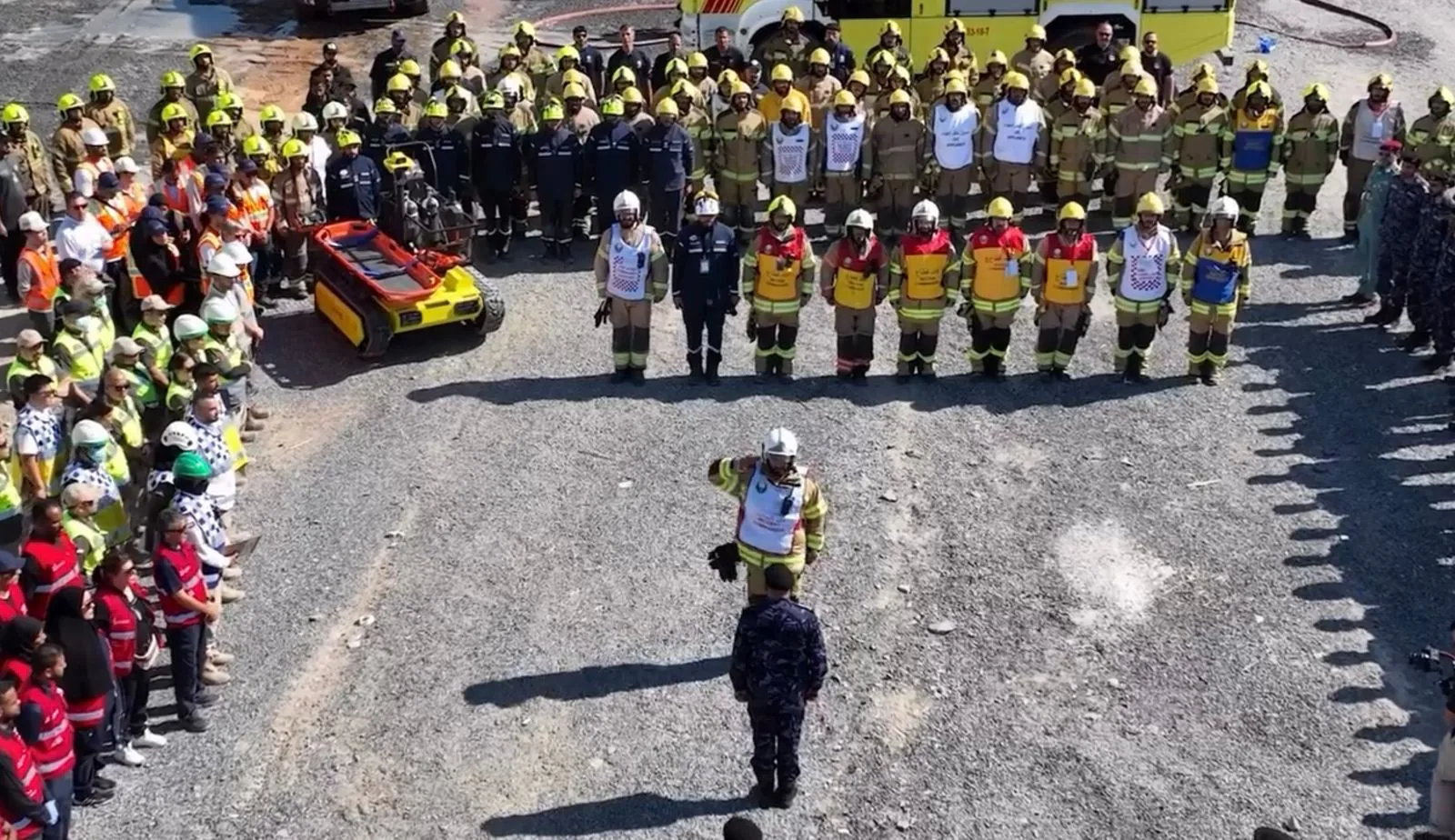 Aerial view of a large crew with the robot