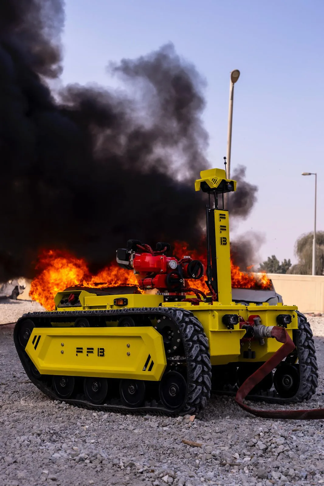 Robot working next to a fire with heavy smoke
