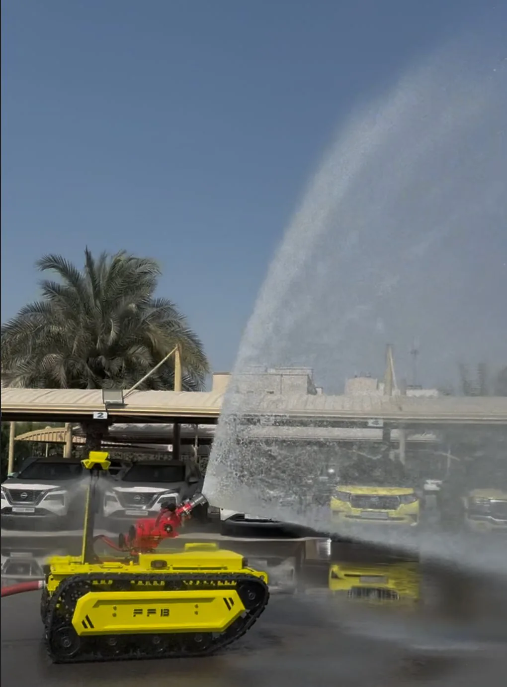 Water spray beside fire vehicles